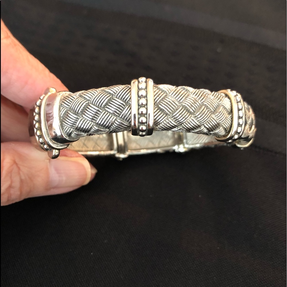 Silver colored rhodium. Basket weave, with detailing and magnetic clasp.